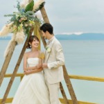 ビーチホテル サンシャイン石垣島　テラス・ウェディングパーティー＆披露宴　オーシャンフロント・テラス会場トライアングルアーチ乾杯シーン